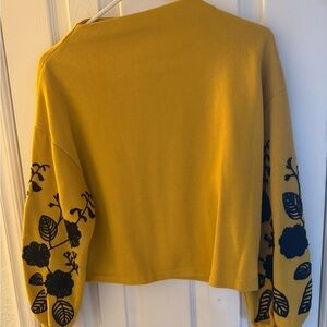 Yellow Sweater with Black Floral Sleeves AS like new, worn once